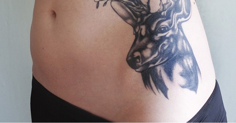 Woman's Deer Hunting Tattoo