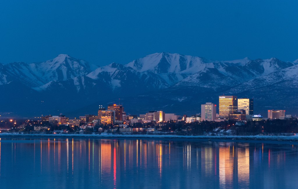 Anchorage, Alaska early evening skyline relecting in the water.