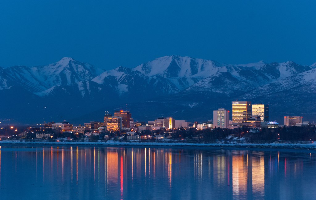 Anchorage, Alaska early evening skyline relecting in the water.