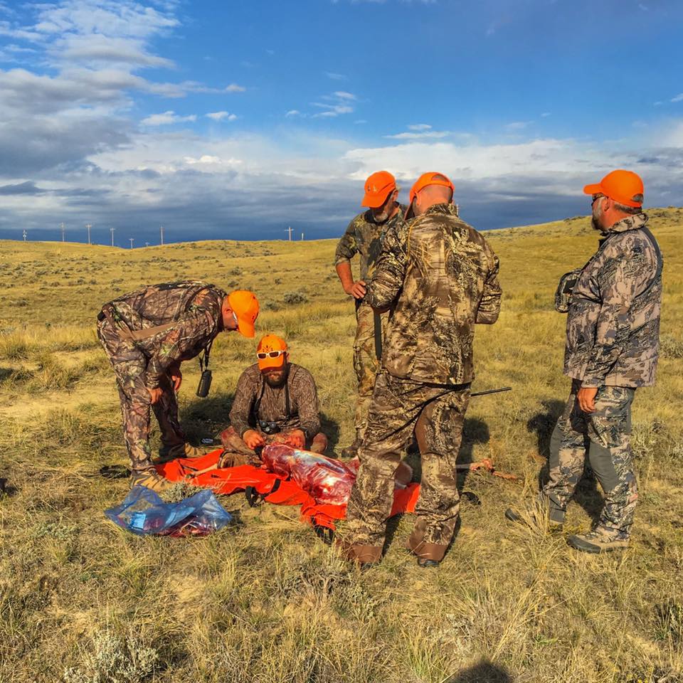 Jeremiah Doughty of Field to Plate dresses an antelope in Midwest Wyoming. Doughty brought along two of the men pictured on the first hunt.