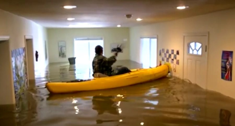 kayaks through her own flooded home