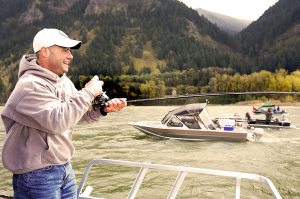 Salmon Fisherman Catching A Fish