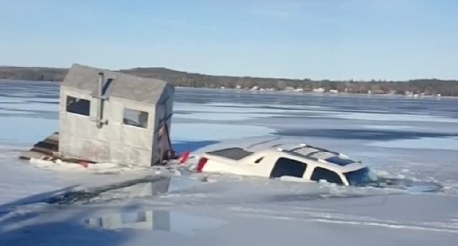 Cadillac Escalade and an ice fishing shack sink