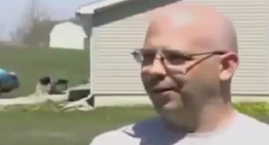 man hits loaded cartridge with hammer