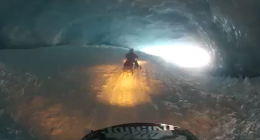 snowmobiling through alaskan ice caves