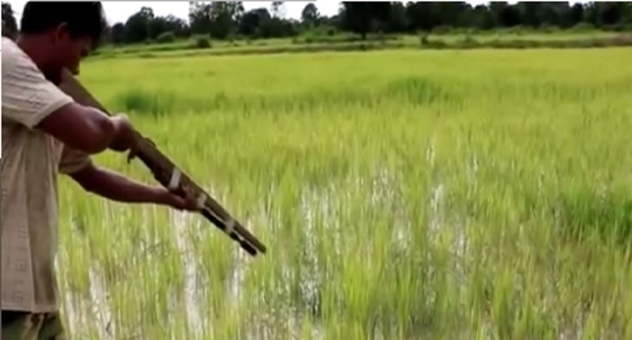 gun fishermen in Cambodia