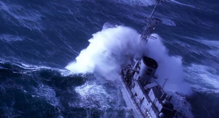 waves attacking warship