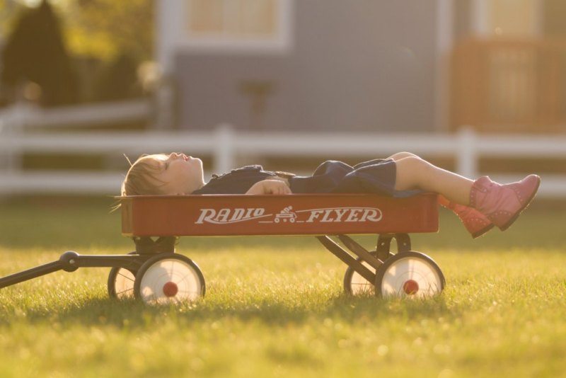 kid relaxing in wagon
