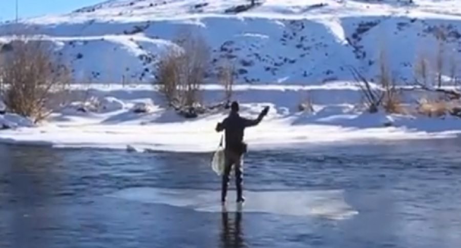 fly fishing from a floating sheet of ice
