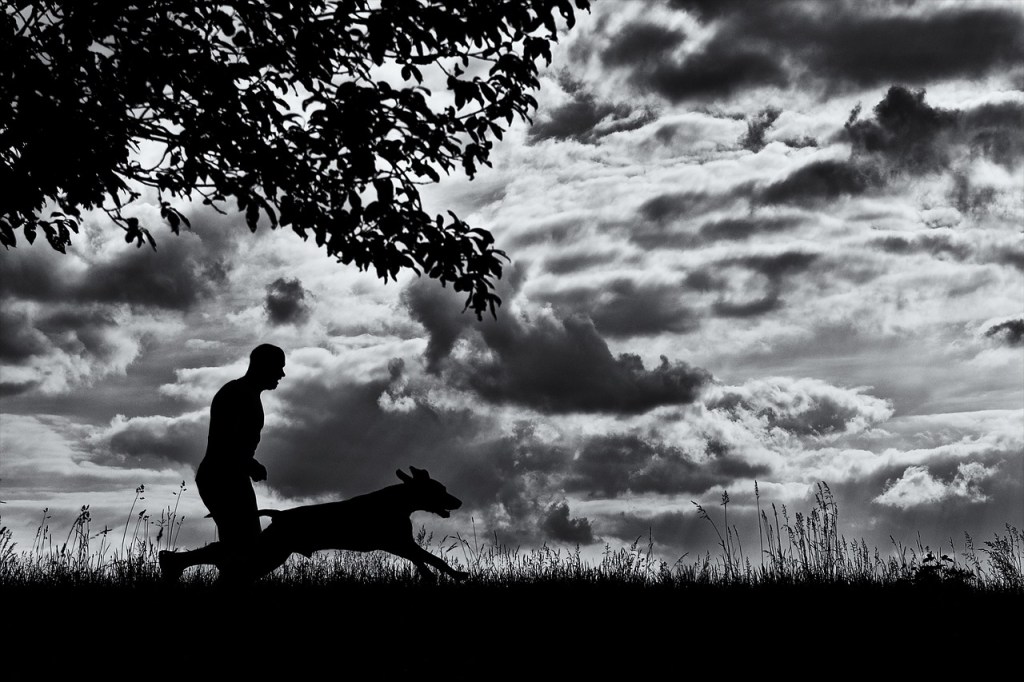 Man running with dog