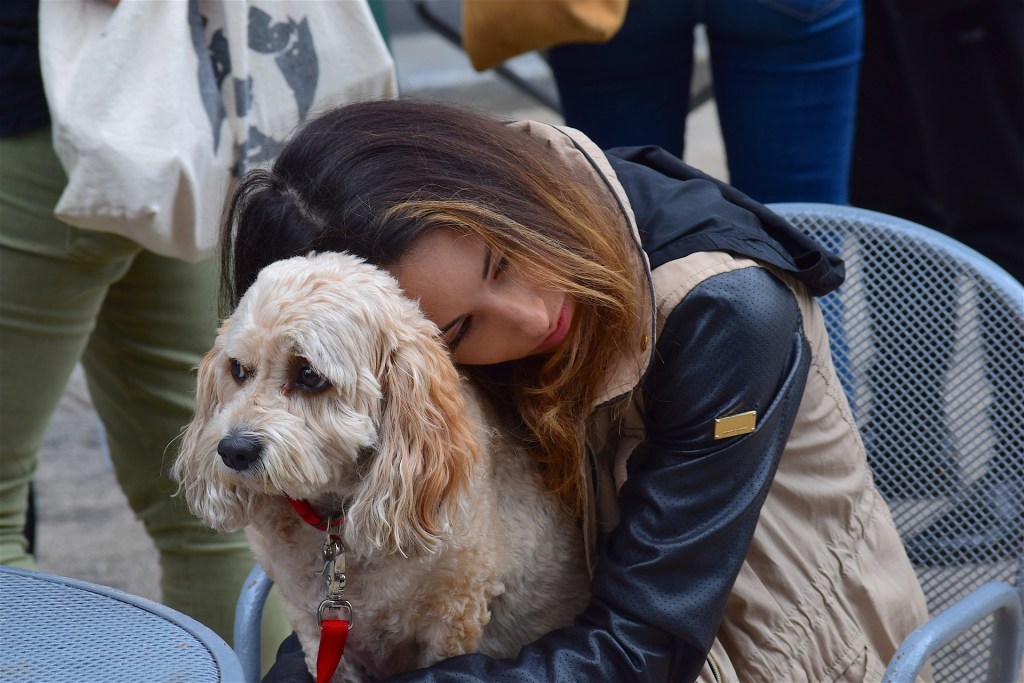 Woman hugging dog