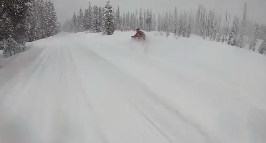 snowmobile buried in snow