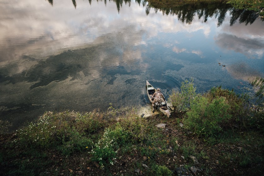 duck hunting with hunter on a boat