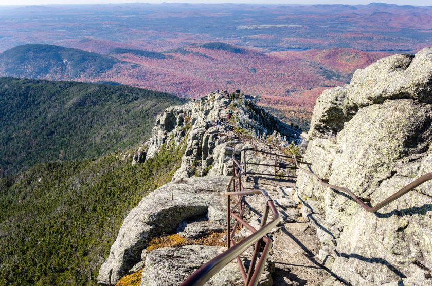 Winding Path Lined with Iron Railings on the Top of a Mountain on a Sunny Autumn Day. Wooded Mountains are Visible in Background. Whiteface Mountain, The Adirondacks, NY.
