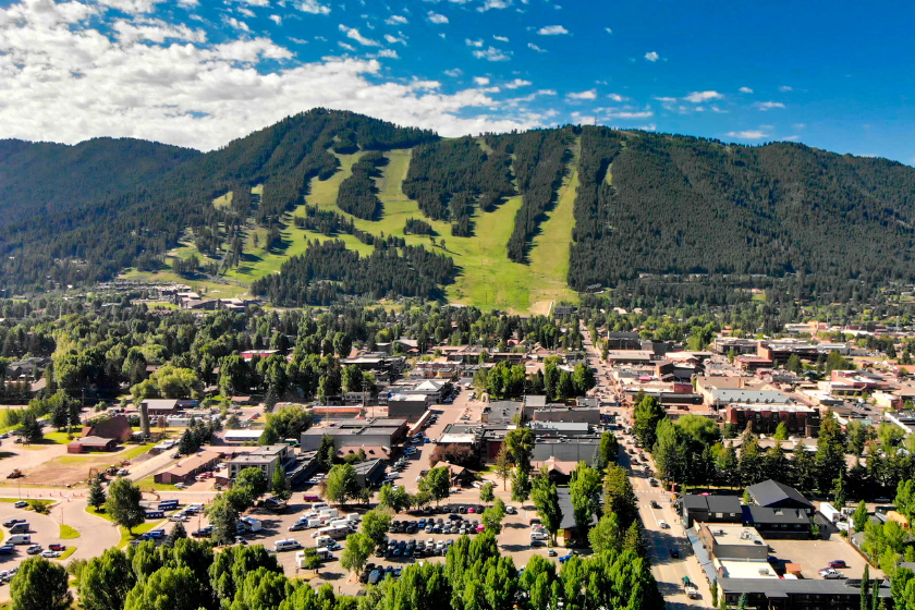 Panoramic aerial view of Jackson Hole homes and beautiful mountains on a summer morning, Wyoming.