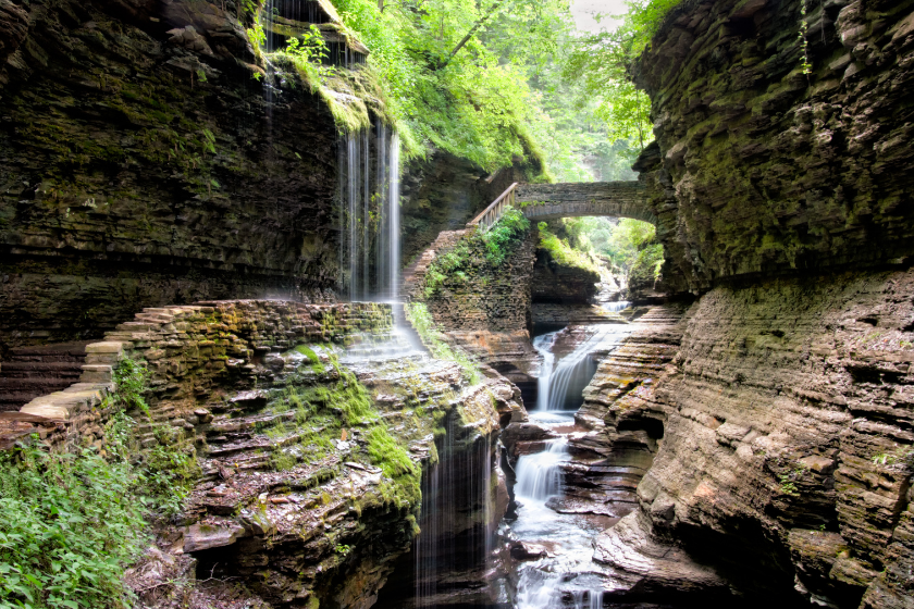 Bridge over waterfall in scenic Watkins Glen Gorge, New York, NY, USA.