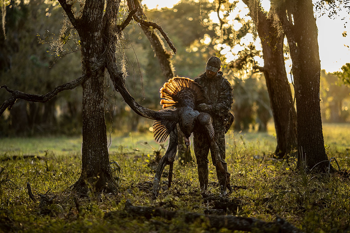 man in camo spring turkey hunting