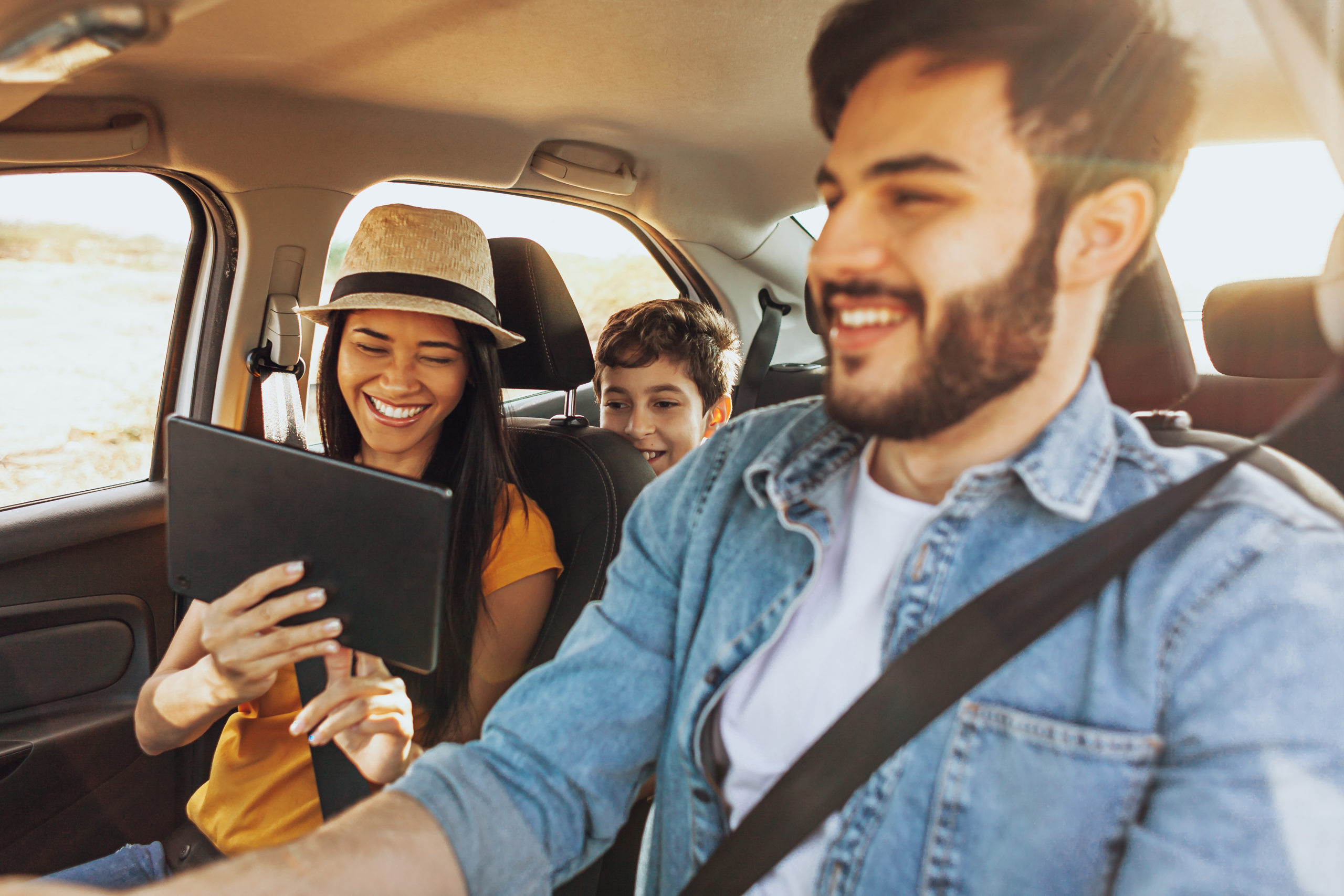 family in car for road trip