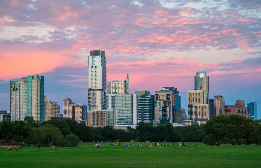 Zilker Park Sunset Austin Texas green grass landscape and perfect glowing Cityscape close up on modern skyscrapers skyline of the Modern 2018 buildings