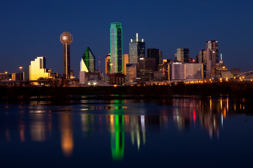 Downtowwn Dallas, Texas at night with the Trinity River in the forground