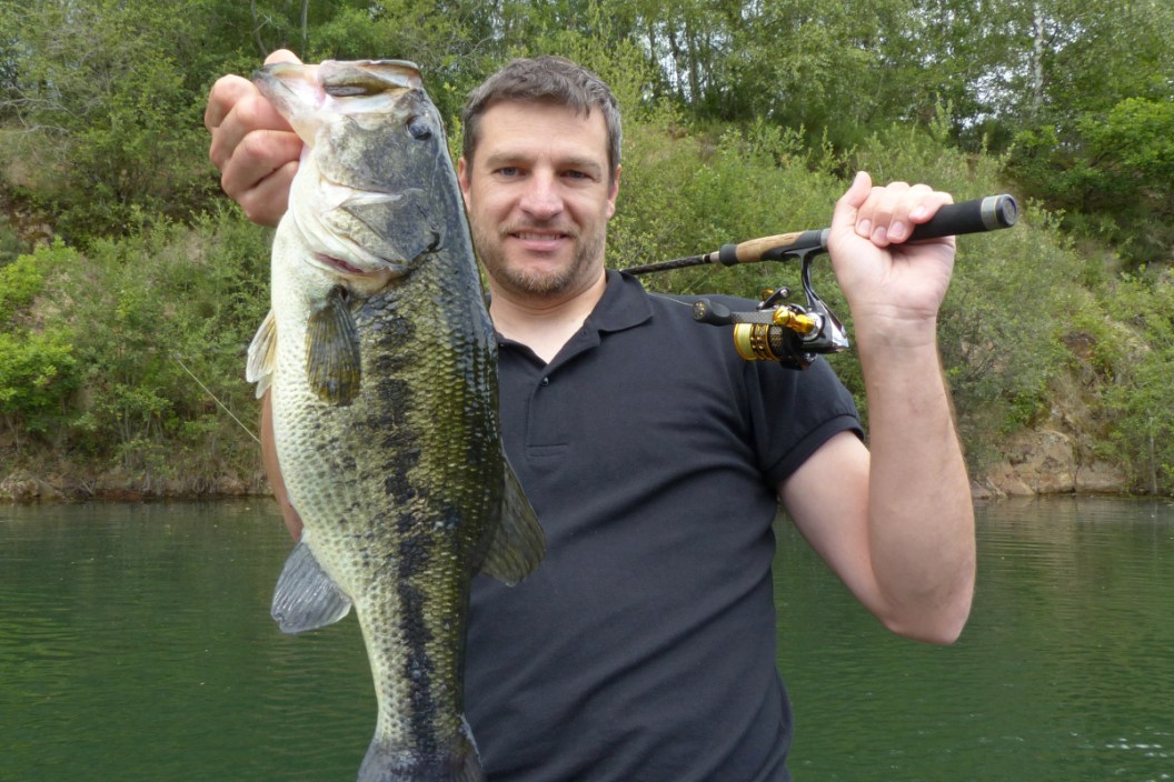 An angler with a large bass caught in the pre-spawn.