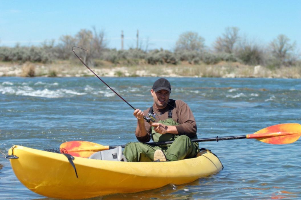 angler in fishing kayak