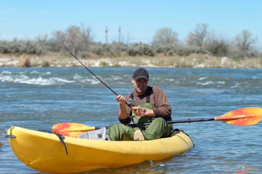angler in fishing kayak