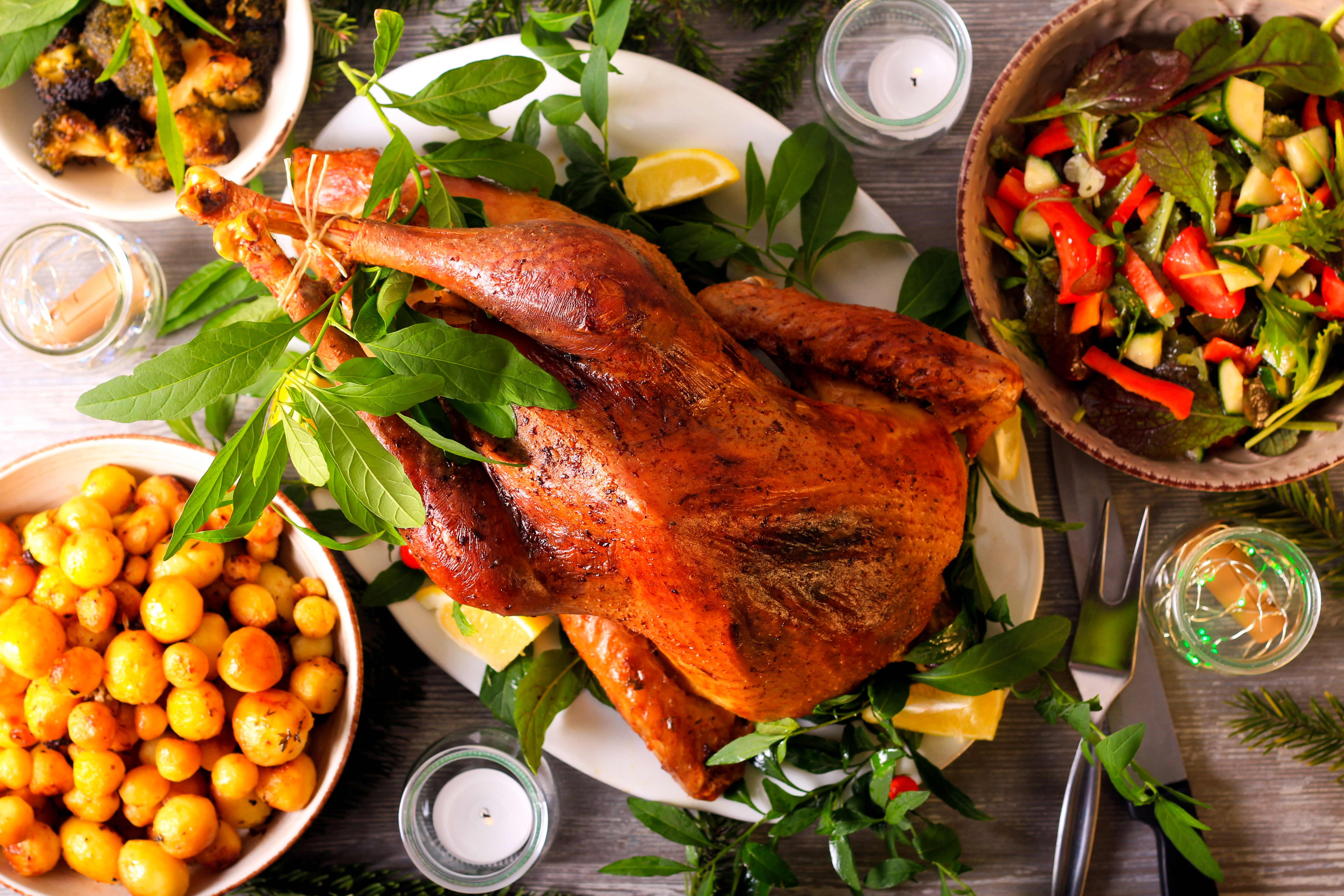 Festive dinner with roast wild turkey and other dishes served on table