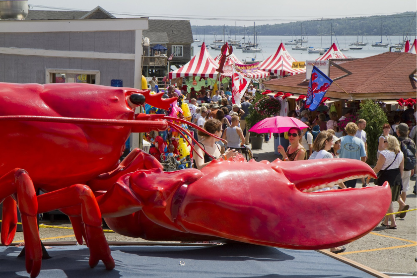best places to visit in august: Large crowd funnels into Rockland's Annual Lobster Festival , past a giant cristacean, on Saurday August 6, 2011 in Rockland, Maine. 
