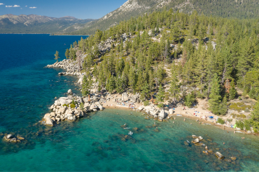 Aerial of the beautiful Chimney Beach on Labor Day, Lake Tahoe, Nevada, USA