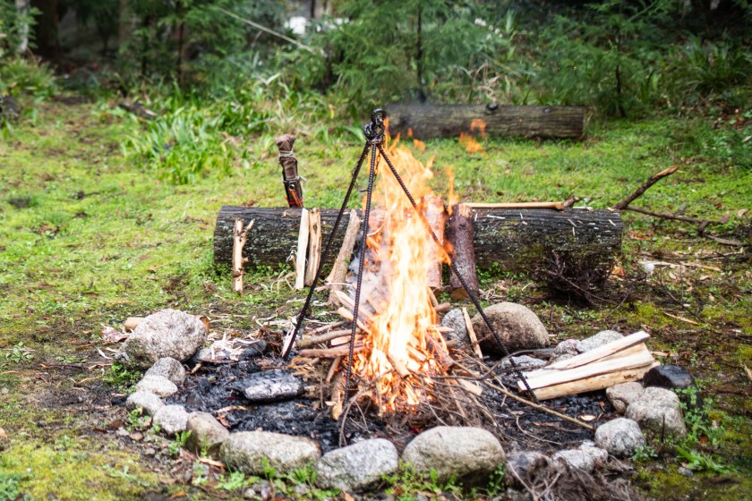 Bushcraft survival fire ring at a campsite