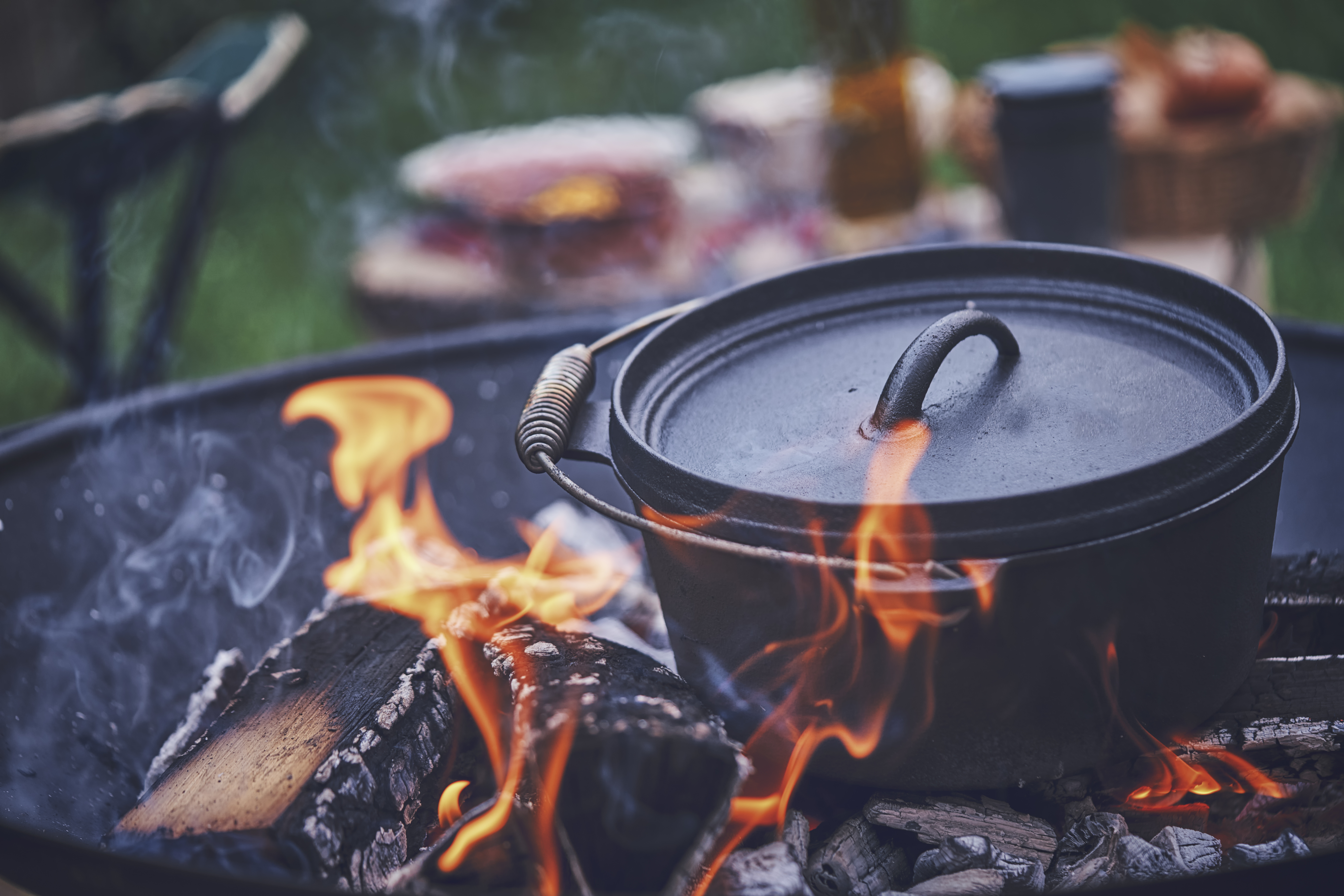 https://www.wideopenspaces.com/wp-content/uploads/sites/3/2021/05/cast-iron-dutch-oven-over-cooking-over-campfire.jpg?fit=7952%2C5304