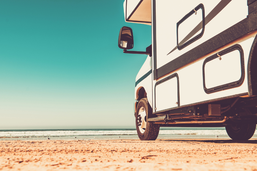 Modern Class C Motorhome Camper Van RV on a Sandy Pismo Beach in California. Summer Vacation Road Trip.