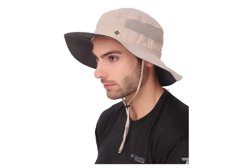 man in beige hiking hat. bucket hat shades face and has adjustable drawstring