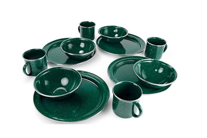 green camping dish set with plates, cups, and bowls