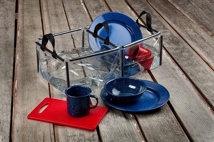 washing camping dishes in a foldable double basin