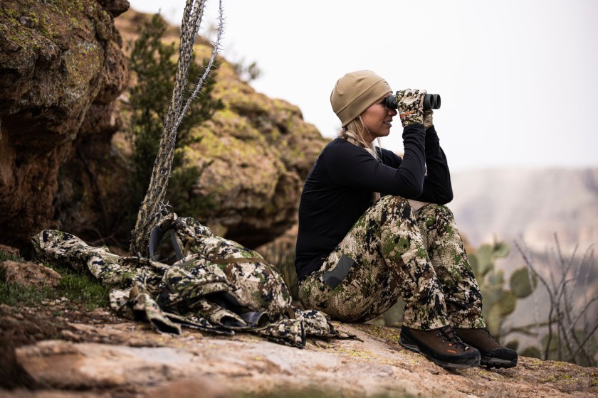 female hunter scouting