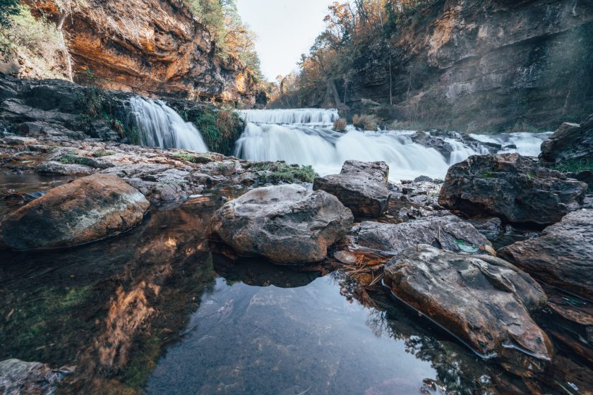 Waterfall at Willow River State Park in Hudson Wisconsin in fall. Daytime long exposure