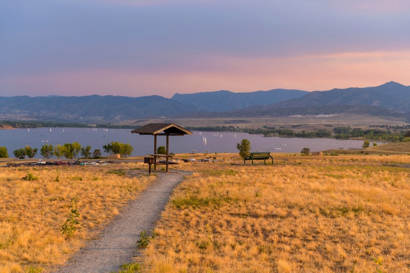 A Summer sunset view of a quiet picnic area at top of Chatfield Dam, Chatfield State Park, Denver-Littleton, Colorado, USA.