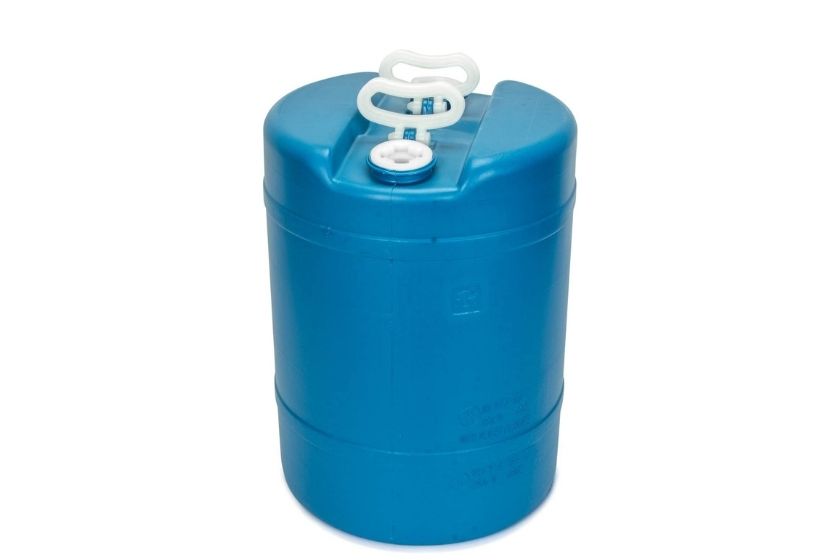 blue water storage barrel with white background