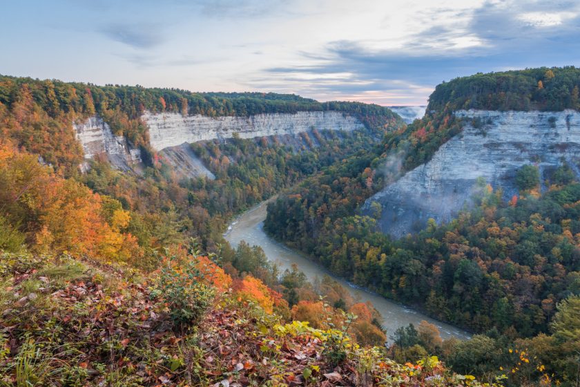 Gorges covered in fall foliage near Archery Field at sunrise creates a majestic scene at Letchworth State Park, NY