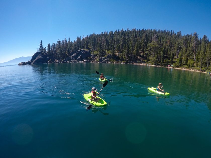 Family plays and swim in and on Lake Tahoe, California