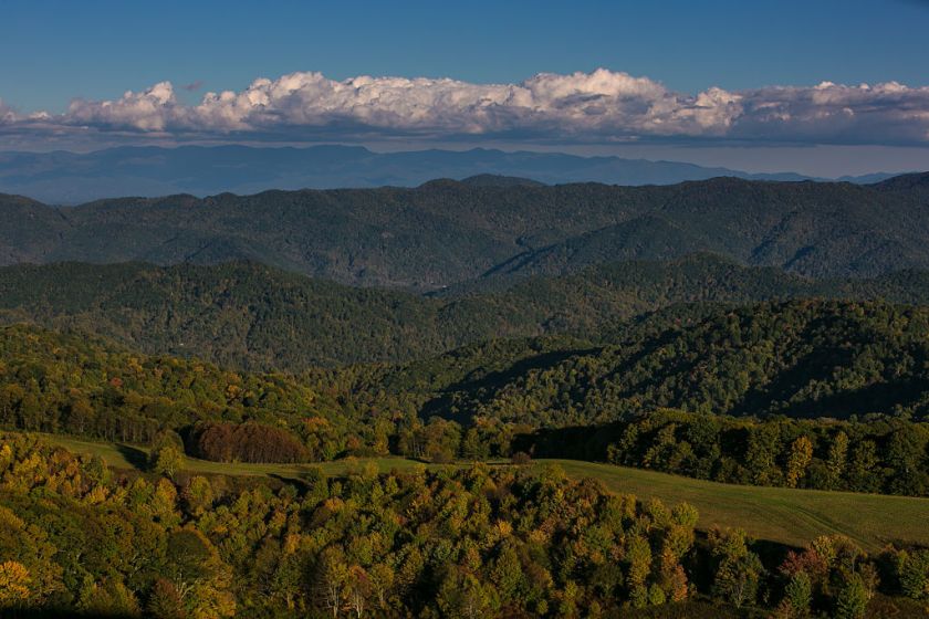 HOT SPRINGS, NC - OCTOBER 8: The evening sky and distant southern horizon is viewed from Max Patch, a bald mountain that is a favorite camping spot for those hiking the Appalachian Trail, on October 8, 2015 near Hot Springs, North Carolina. Named one of the "Top 10 Great Places to Retire" by AARP, Asheville, and the surrounding western Carolina region, is experiencing a minor cultural revolution, with the addition of new restaurants, live music, and a vibrant arts community.