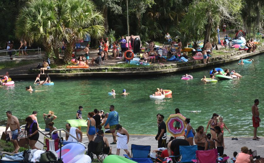 People cool off in the water on Labor Day at Wekiwa Springs State Park on September 7, 2020 in Apopka, Florida. State officials are hoping that capacity crowds such as these do not result in a spike of coronavirus cases