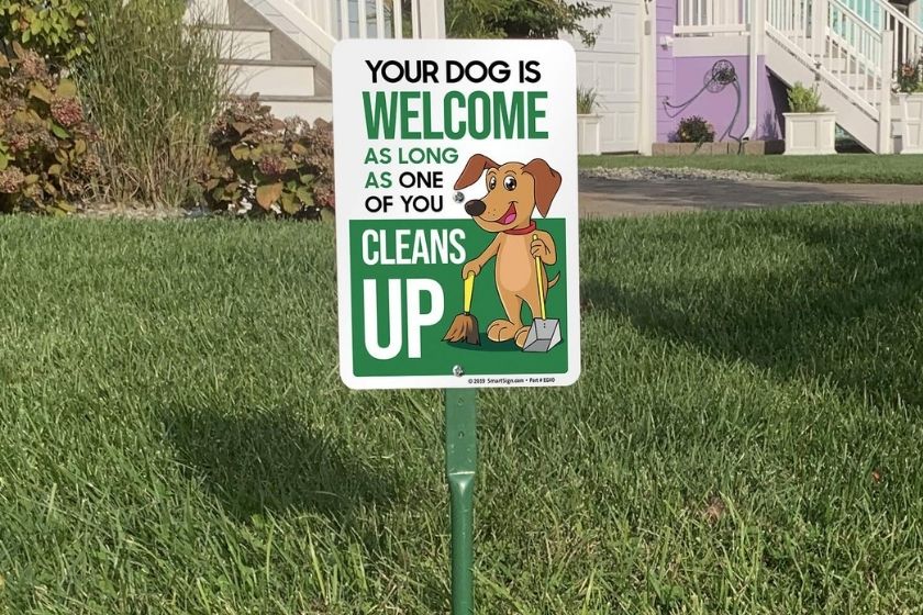 dog is welcome clean up sign
