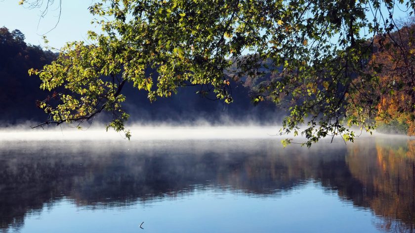 Marion, Virginia / USA - October 14, 2020: Mist rising from Hungry Mother Lake on an autumn morning at Hungry Mother State Park