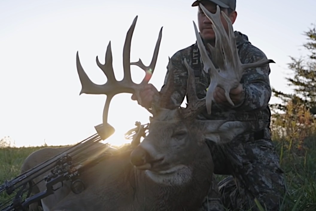 Bowhunter with a Massive, 240-inch Buck.