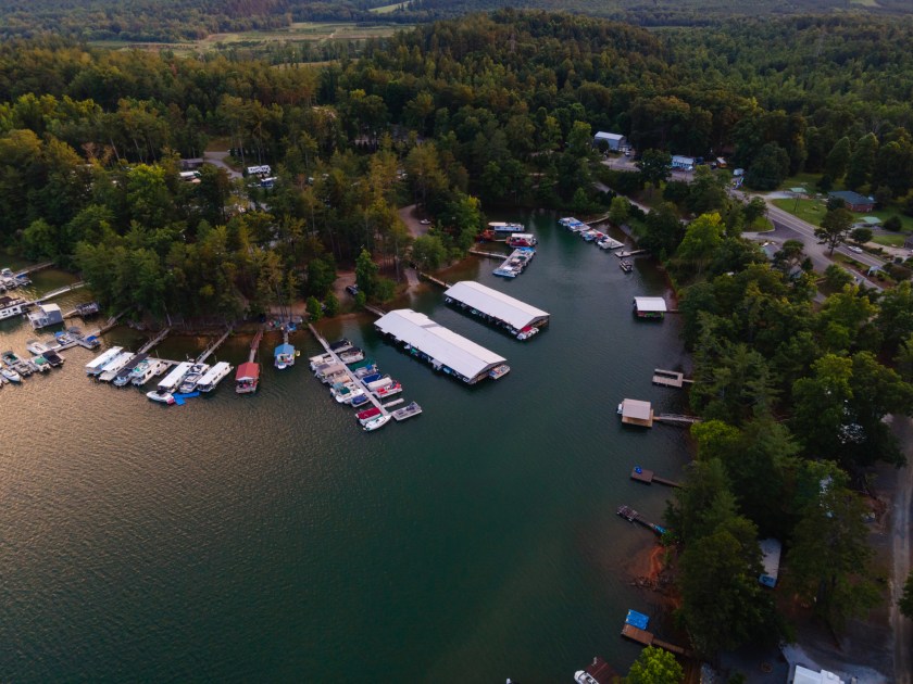 Aerial view at dusk on a summer evening of a cove with marinas on Lake James, North Carolina.