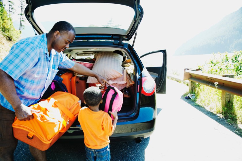 Father and son loading car