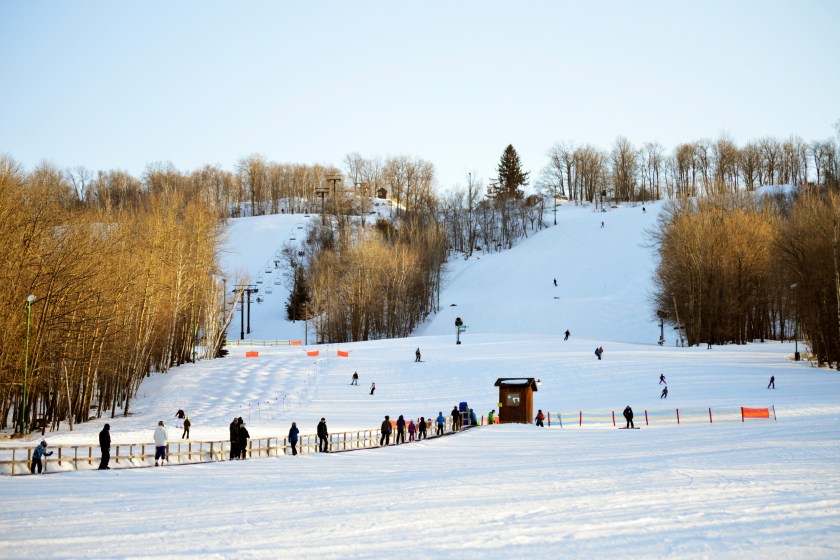 Skiers skiing down a hill in Wisconsin